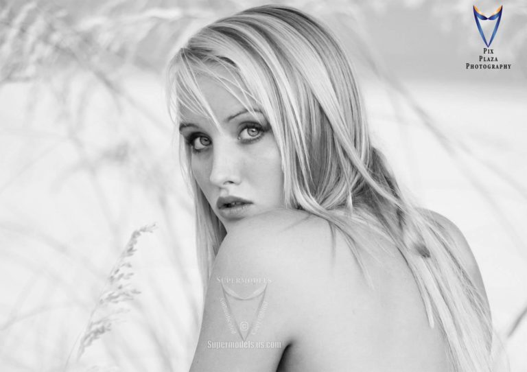 Young girl looking over her shoulder in black and white photo